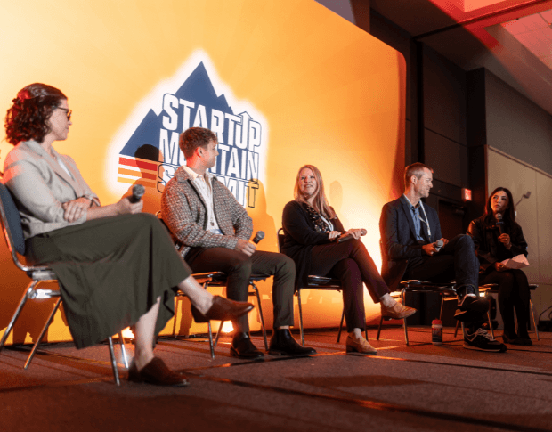 A panel on stage at the Startup Mountain Summit