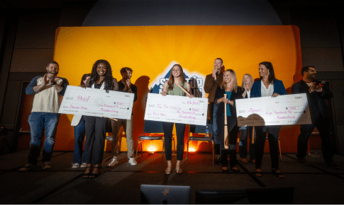 Pitch competition winners holding a cheque